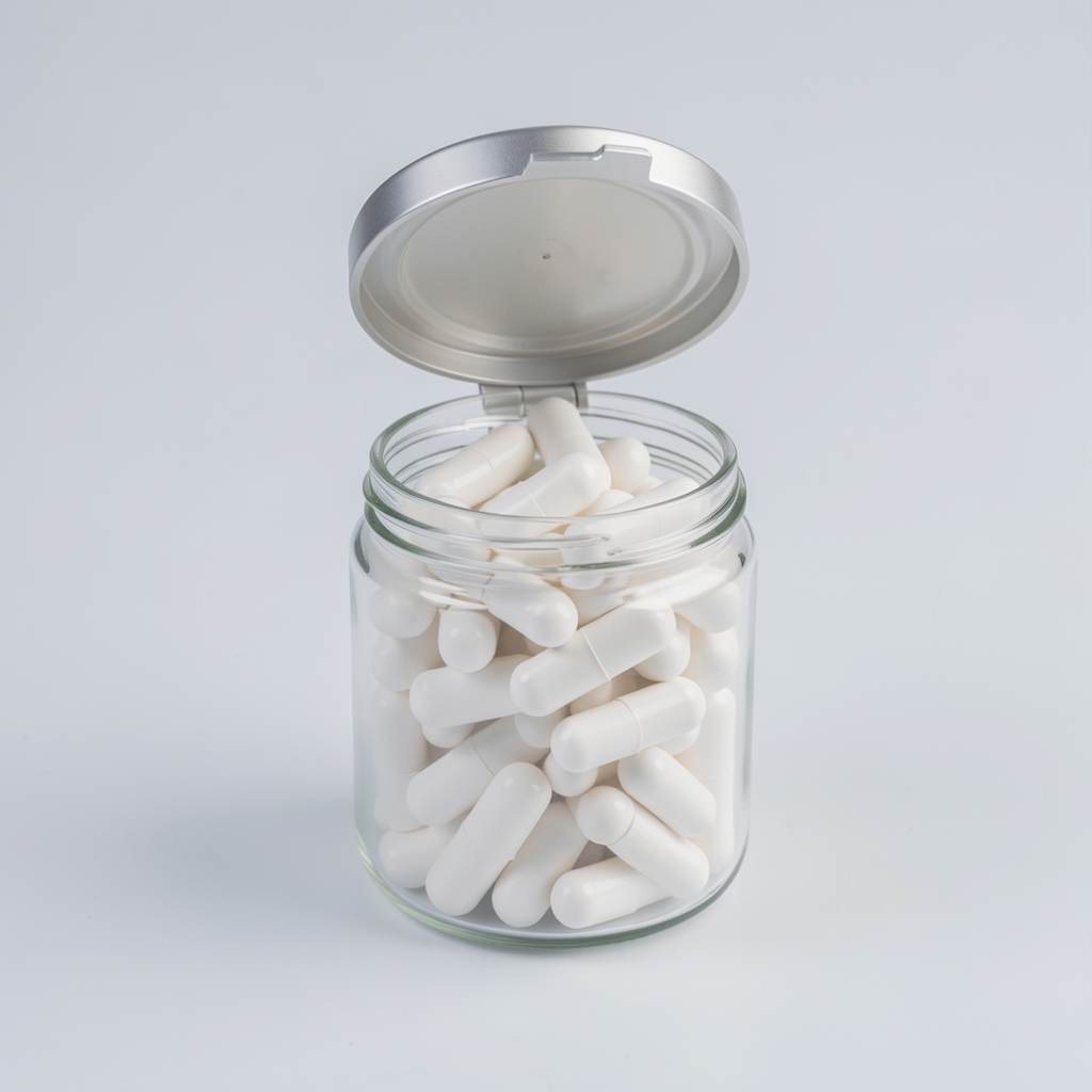 Vitamin supplement jar with its lid open showing white capsules inside, placed on a clean pale background with soft studio lighting
